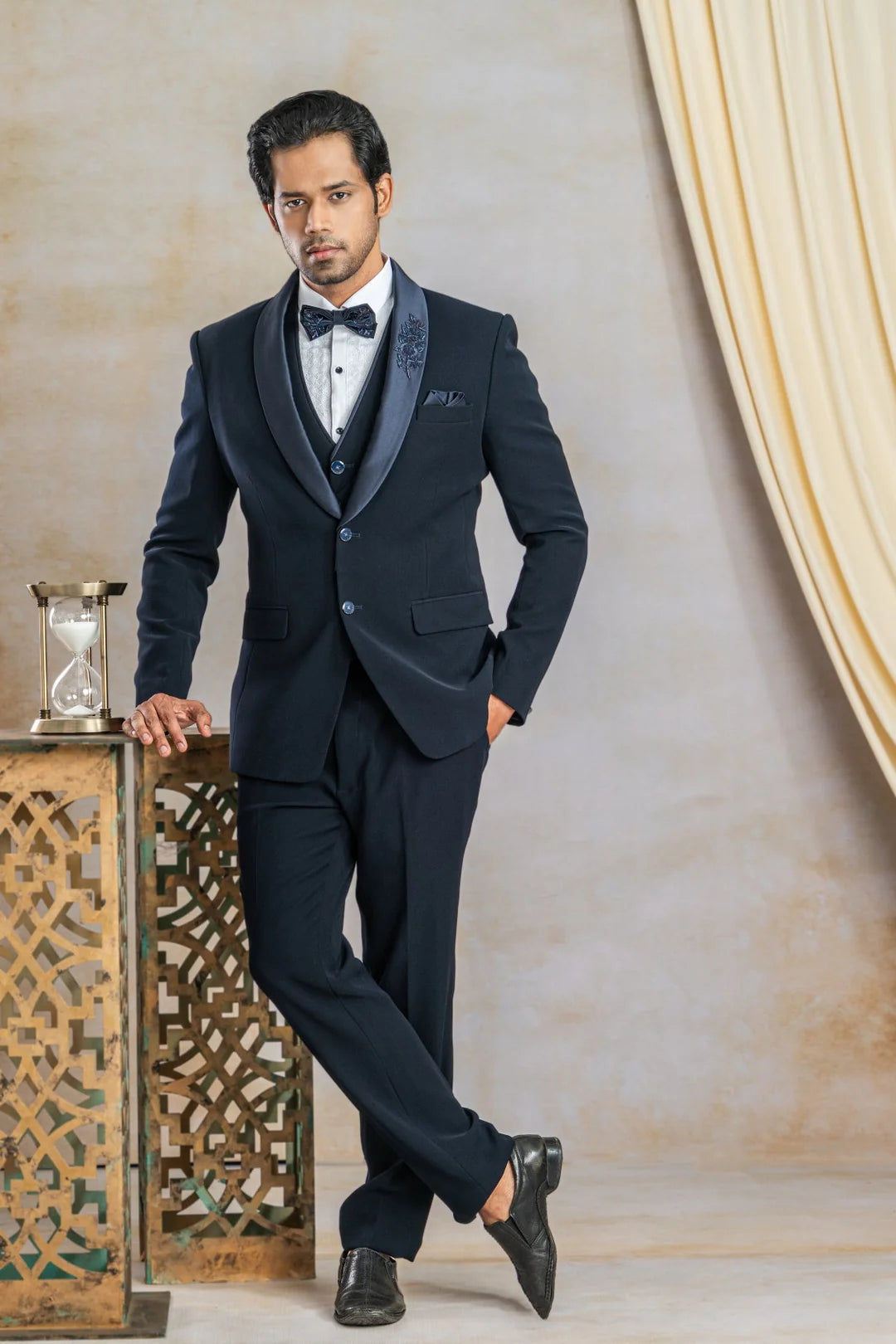 Navy blue suit with hand work on satin lapel