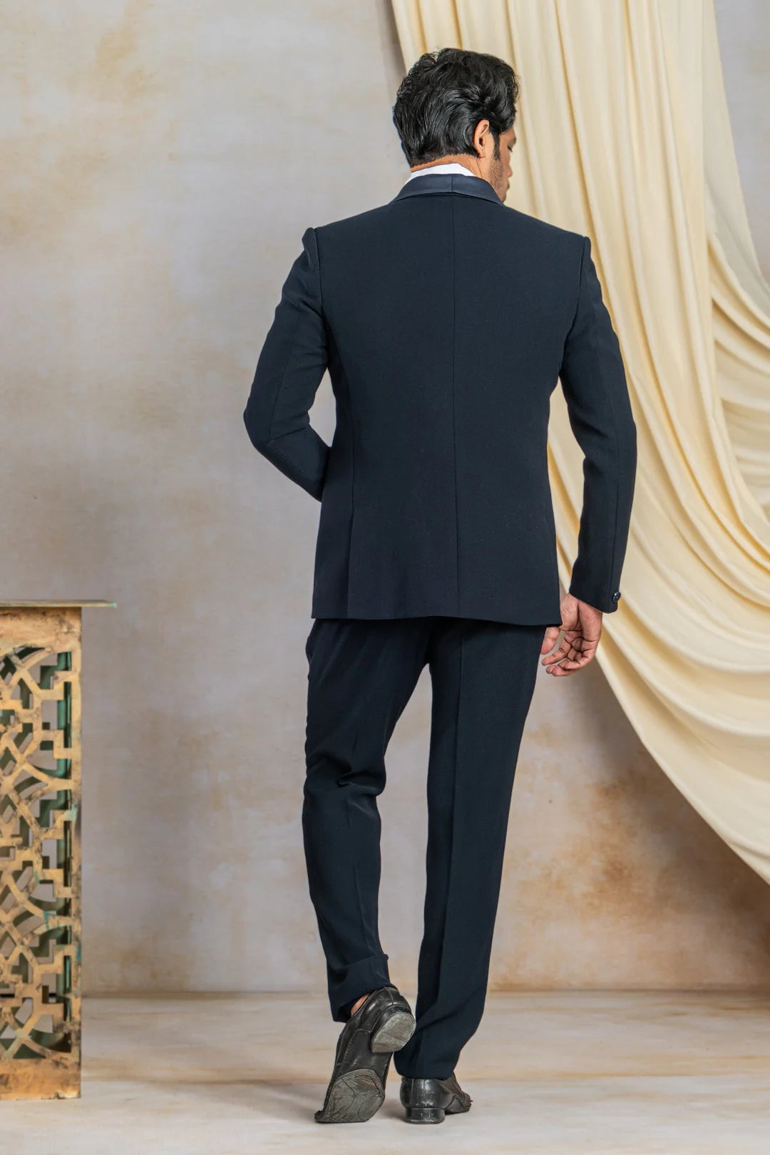 Navy blue suit with hand work on satin lapel