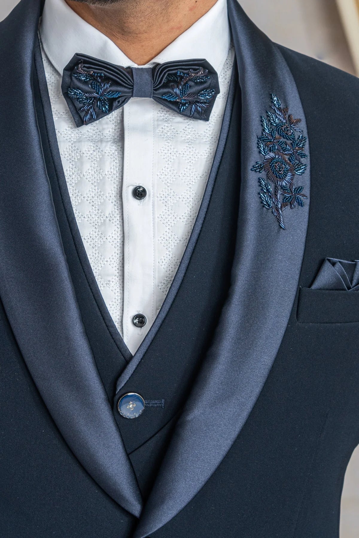 Navy blue suit with hand work on satin lapel