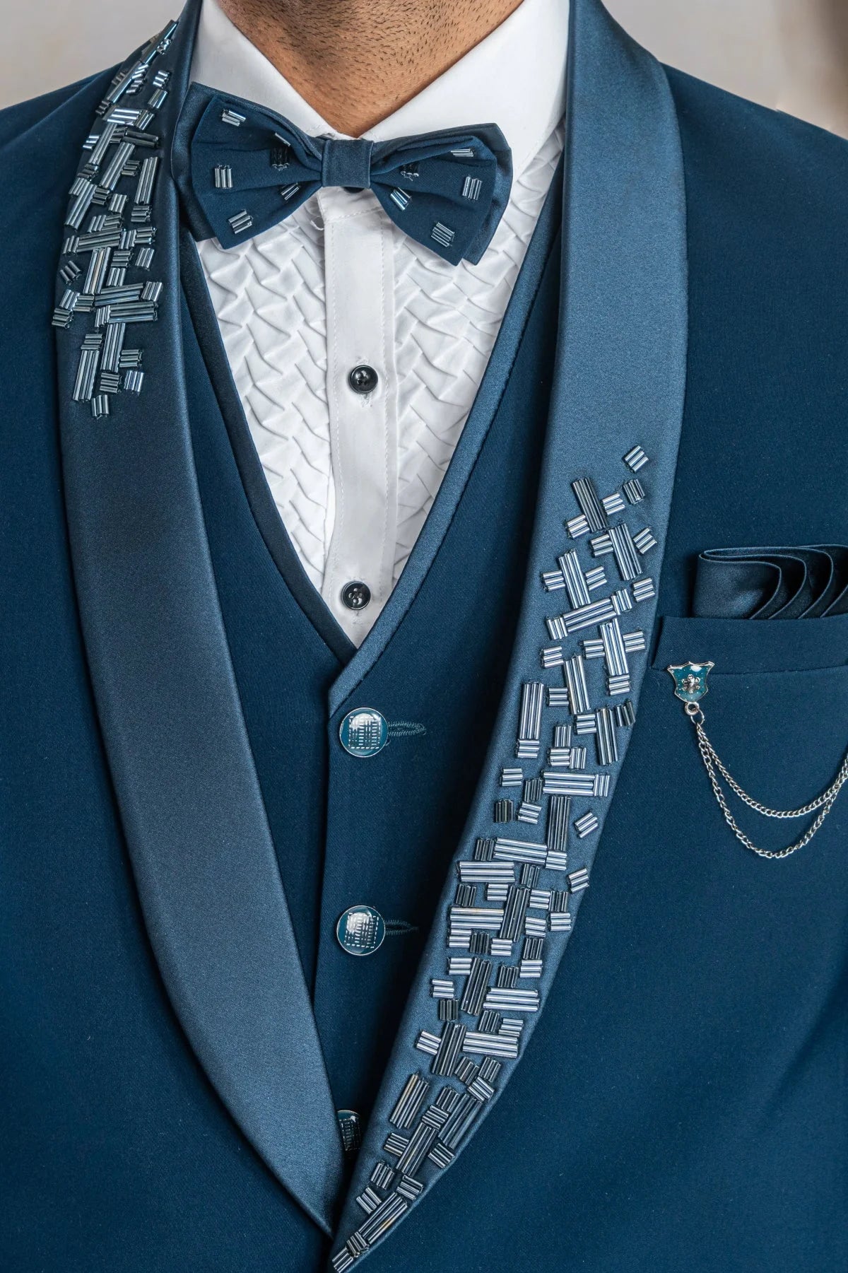 Peacock blue suit with hand work on satin lapel