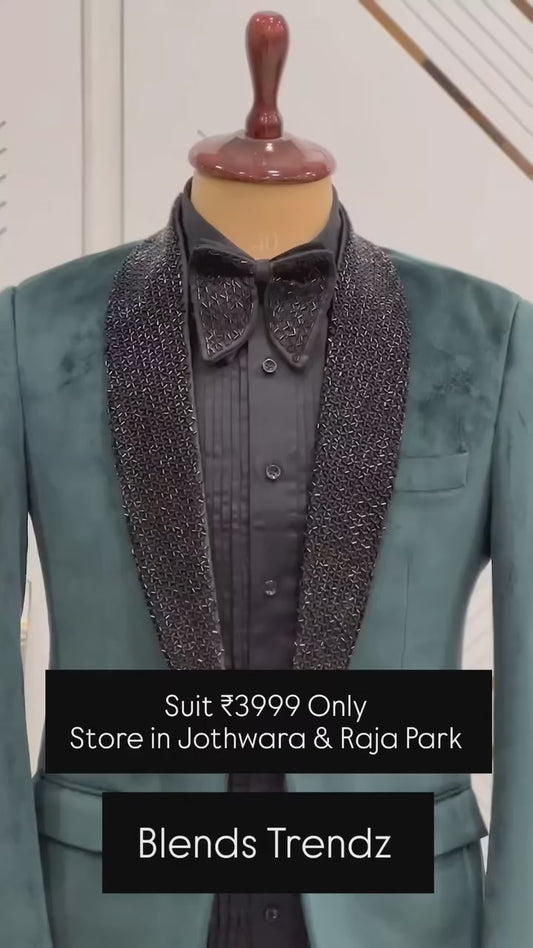 Green suit with hand work on satin lapel