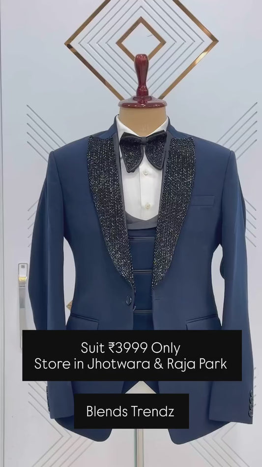 Blue suit with hand work on satin lapel