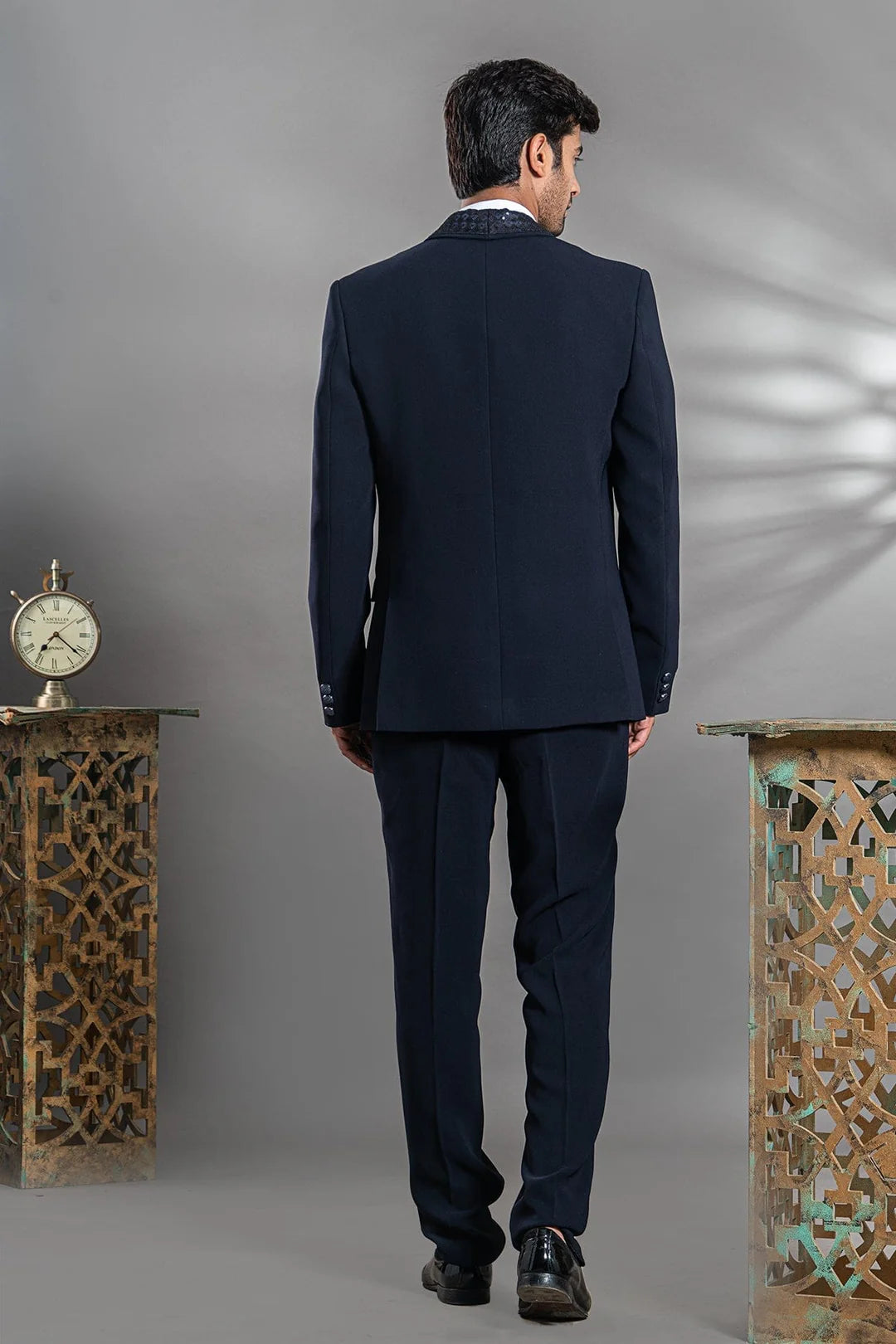 Navy blue suit with stylish sequence lapel and bow