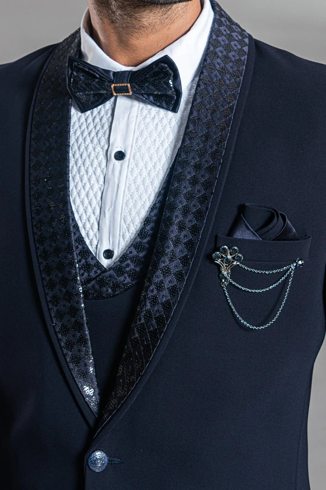 Navy blue suit with stylish sequence lapel and bow